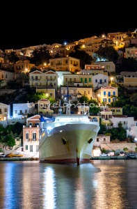 Glass port Symi harbor evening houses boat