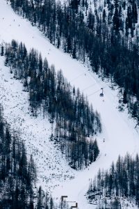 Part of the Plattjen section in the Saas-Fee ski station, the black run and the Alpin Express funicular